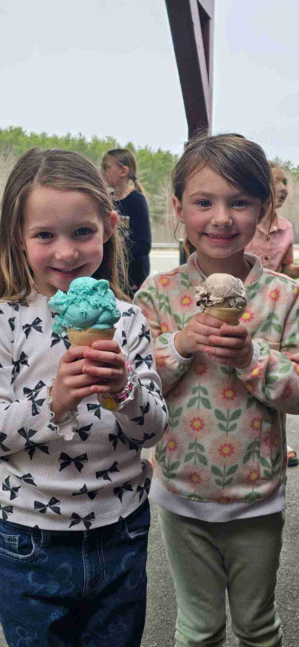 Children enjoying ice cream cones at Sanctuary dairy farm