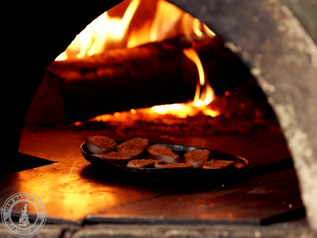 wood fire pizza oven with pan or garlic bread baking